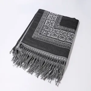 Elegantes geometrisches Quastentuch für Damen, warmer Winterschal und modischer Umhang.