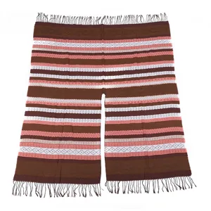 Close-up detail of women fringe split cape shawl, soft warm color block design blanket.