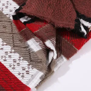 Detailed close-up of color-block plaid imitation cashmere shawl with delicate fringe.
