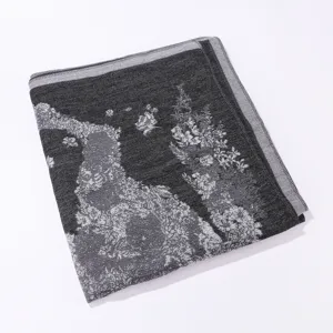 Detailed view of the black and grey knitted jacquard shawl with retro horse pattern style.