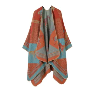 Detailed view of the retro horse patterned knitted cape, featuring geometric colorblock design.