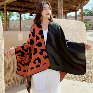 Cozy winter knitted shawl and cape, stylish color-block design, soft warm blanket wrap.