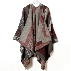 Detailed view of the thick knitted retro geometric pattern cashmere-feel shawl cape fabric.