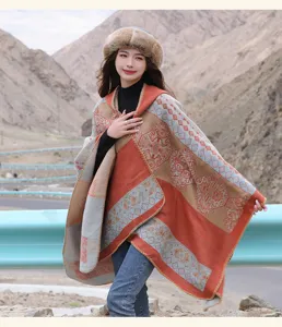 Detailed outdoor view of a thick ethnic style hooded shawl, perfect for winter travel.