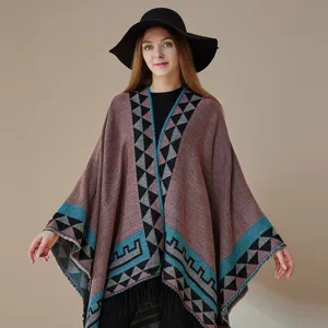 Boho geometric poncho shawl detail, vintage fringe cape cardigan, stylish ethnic outdoor wrap.