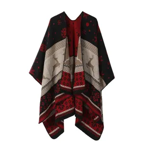 Detail view of the Christmas reindeer knit poncho cape, warm imitation cashmere fabric pattern.