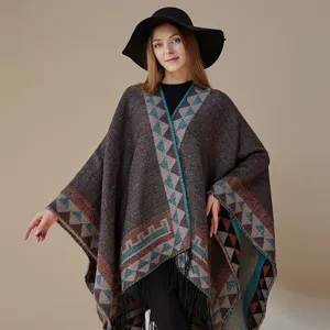 Bohemian ethnic style cape coat for travel, stylish geometric pattern poncho shawl outerwear.