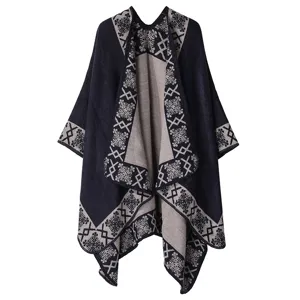 Detailed view of winter women's knitted shawl cape, warm thickened fleece outerwear poncho.
