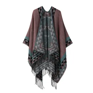 Bohemian geometric knit poncho detail, ethnic fringe shawl, stylish tribal wrap cape, cozy winter layer.