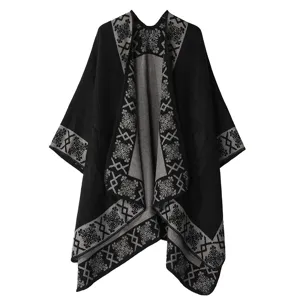 Winter women's black knitted cape shawl with elegant grey geometric pattern open front design.