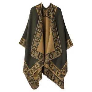 Close-up detail view of winter women cashmere feel cape geometric border pattern dark green
