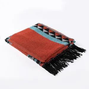 Bohemian ethnic style knitted shawl scarf with geometric pattern and fringe details.