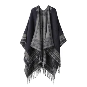 Bohemian geometric pattern fringed poncho detail shot, stylish blue and grey cape.
