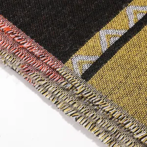 Detail view of woven fringe geometric patterned winter warm imitation cashmere scarf.