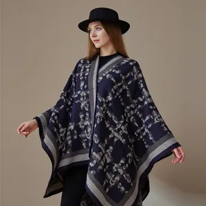 Detail shot of women's autumn winter plaid cashmere cloak cape shawl outerwear warm fashion design.