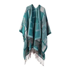 Detail view of the autumn winter women knitted plaid cape shawl with fringe and warm poncho design.