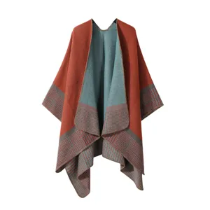 Detailed view of the red and blue reversible knitted cape with stylish plaid hem for women