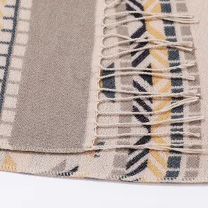 Ethnic style woven shawl detail, geometric patterned warm blanket scarf with chic fringe edges.