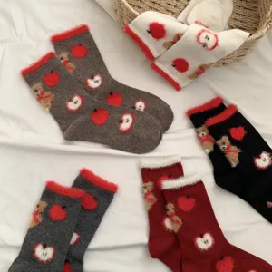 Cozy fuzzy winter crew socks featuring cute teddy bear and red apple pattern details.