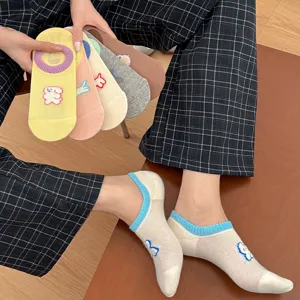 Close-up of cute cartoon puppy embroidered low-cut socks, breathable mesh style.