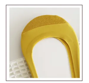 Detail view of yellow anti-slip invisible socks, breathable summer thin silicone boat socks.