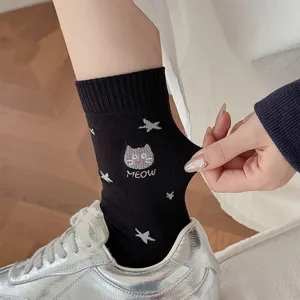 Detailed view of cute cat embroidery mid tube cotton socks with star patterns for women.