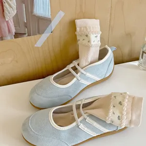 Chic floral bubble cuff stacking socks paired with light blue flat shoes, soft and stylish.