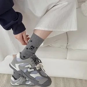 Detailed view of grey cotton mid-tube socks featuring cute cat and star embroidery.