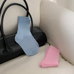 Candy color ribbed mid-tube socks detail, soft cotton daily wear socks in light blue and pink.