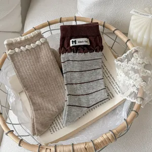Cozy women mid tube knit socks with cute pom pom and stripe patterns for daily casual wear.