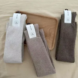 Thickened over-the-knee fleece warm long stockings, cozy winter cotton thigh-high socks.