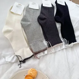 Combed cotton mid-calf socks with cute split back design and four classic colors.