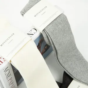 Solid color vertical stripe knee high cotton socks with clean packaging for daily wear.