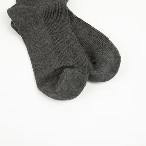 Dark grey ribbed cotton socks detail shot, showing soft knitted texture and close-up view.