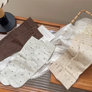 Detailed view of vintage style floral mid-calf socks featuring cozy cotton and prints.