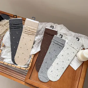 Detail view of cozy floral mid-tube socks in multiple soft vintage colors for daily wear.