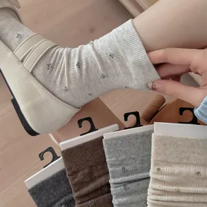 Womens cotton mid-calf slouch socks with cute floral print, comfortable daily casual wear.