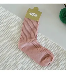 Pink ribbed mid-tube socks with Moyai brand tag, comfortable cotton daily casual wear.