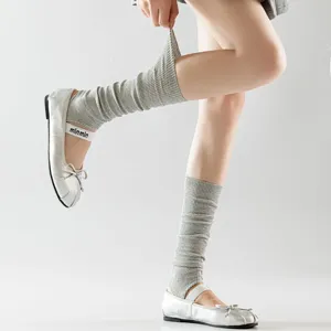 Grey knit stirrup leg warmers detail, ballet style slouchy calf socks for spring wear.