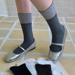 Ribbed color-blocked crew socks detail, cozy stacked style, comfortable winter hosiery.