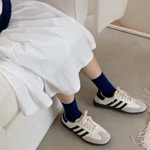 Comfortable solid color ribbed mid-tube socks for daily wear, stylish fashion hosiery.