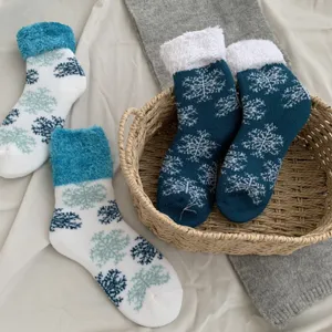 Cozy fleece-lined thermal winter socks with classic snowflake pattern and fluffy cuff for women.
