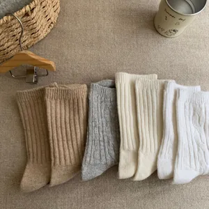 Women vintage thick wool mid-calf socks casual solid color cable knit winter warm socks.
