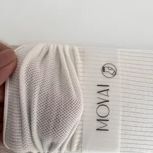 White mesh mid-calf socks for women, breathable solid color design with rolled cuff detail.
