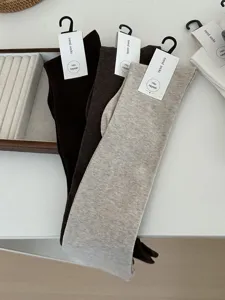 Cozy over-the-knee long socks for women, soft knit winter hosiery, multiple solid colors.