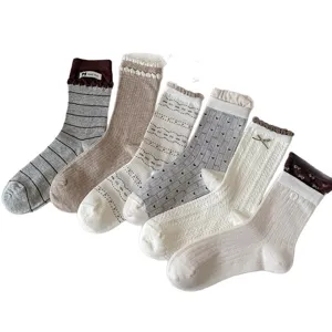 Cute women mid-tube socks set, various cute styles like bows, hearts, and stripes.