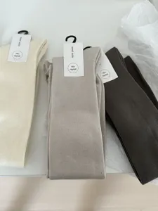 Cozy winter cashmere blend over-the-knee long socks in neutral colors, warm and soft.