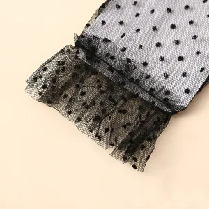 Black polka dot lace glove detail, sheer mesh ruffle design for elegant bridal and evening wear.