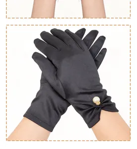 Detailed view of elegant black satin short gloves featuring a pearl rhinestone wrist detail.
