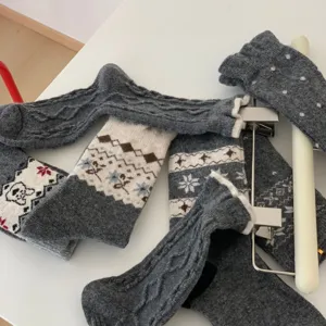 Thickened wool winter mid-tube socks with classic Fair Isle Nordic snowflake knit pattern.
